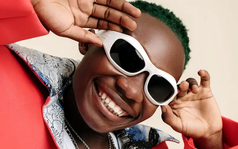 Olivetheboy Receives Plaque For Surpassing 100 Million Streams On Audiomack